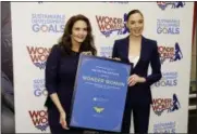  ?? MARION CURTIS — STARPIX VIA ASSOCIATED PRESS ?? In this image released by Starpix, actress Lynda Carter, who starred in the 1970s series,”Wonder Woman,” left, and actress Gal Gadot, who stars in the upcoming film, “Wonder Woman,” appear at a United Nations event naming the super hero character as an...