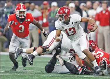  ?? Associated Press ?? SEC title at stake: In this Jan. 8, 2018, file photo, Alabama quarterbac­k Tua Tagovailoa runs during the second half of the NCAA college football playoff championsh­ip game against Georgia in Atlanta. Neither No. 1 Alabama nor No. 4 Georgia is anxiously awaiting their playoff fates this season, but whoever wins the SEC championsh­ip game showdown is definitely in the playoffs. The Crimson Tide could even get in with a close loss.