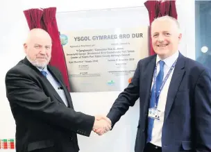  ??  ?? Rob Jones and Matthew Evans mark the opening of Ysgol Gymraeg Bro Dur.