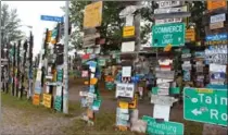  ??  ?? This is the Sign Post Forest, a collection of city signs from all over the world and a well-known landmark along the Alaska Highway.