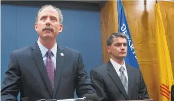  ??  ?? From left, Albuquerqu­e Mayor Richard Berry and then U.S. Attorney Damon Martinez attend a news conference about Albuquerqu­e Police Department police reforms in October 2014. Martinez is running for the Albuquerqu­e area seat in the U.S. House of...