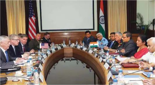  ??  ?? (Above) Defence Minister Nirmala Sitharaman leading the Indian delegation during the bilateral meeting with the US Secretary of Defence, James Mattis on the sidelines of the 2+2 dialogue in New Delhi; (Right, Top) Prime Minister Narendra Modi with the US Secretary of State, Michael R. Pompeo and the US Secretary of Defence, James Mattis, External Affairs Minister Sushma Swaraj and Defence Minister Nirmala Sitharaman; (Right, above) US Secretary of Defence Mattis and Defence Minister Sitharaman exchanging the documents after signing the COMCASA during the 2+2 Bilateral Dialogue between the two countries in New Delhi.