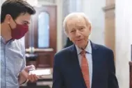  ?? AP PHOTO/ALEX BRANDON ?? Former Sen. Joe Lieberman of Connecticu­t, right, speaks with a reporter in 2021 at the Capitol in Washington. Lieberman died March 27 according to a statement issued by his family. He was 82.