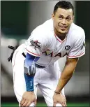  ?? Associated Press photo ?? In this Aug. 14, file photo, Miami Marlins' Giancarlo Stanton stands on the field during a baseball game against the San Francisco Giants in Miami.