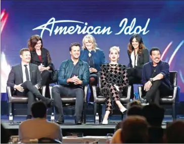  ??  ?? From back left, executive producer Jennifer Mullin, showrunner/executive producer Trish Kinane, co-executive producer Megan Michaels Wolflick, host Ryan Seacrest, judges Luke Bryan, Katy Perry and Lionel Richie of the television show speak onstage...