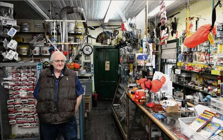  ?? Photos by Will Waldron / Times Union ?? Mike Conroy, owner Conroy’s Bait Supply at the fishing store on 19th Street in Watervliet has noticed a change in the winter. “Definitely the season has gotten shorter,” he says. Temperatur­es in January in Albany reached at least 30 degrees Fahrenheit each day according to the National Weather Service.