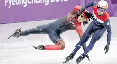  ?? AP PHOTO/JULIE JACOBSON ?? Samuel Girard, left, of Canada is airborne after colliding with Sjinkie Knegt of the Netherland­s during their men’s 5000 meters short track speedskati­ng relay heat in the Gangneung Ice Arena at the 2018 Winter Olympics in Gangneung, South Korea, Tuesday.