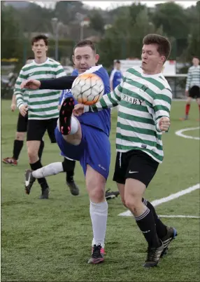  ??  ?? Paul Conyard of Ashford Rovers and Josh Davenport of Greystones United battle for possession.