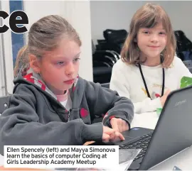  ??  ?? Ellen Spencely (left) and Mayya Simonova learn the basics of computer Coding at Girls Leadership Academy Meetup