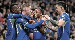  ?? Picture: GETTY IMAGES/ALEX PANTLING ?? ALL SMILES: Chelsea’s Cole Palmer, second from left, celebrates scoring the winner with teammates during the Premier League match against Newcastle United at Stamford Bridge, in London, on Monday.