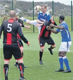  ??  ?? Paul Grumoli and Sary Rahma in action earlier in the league.