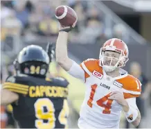 ?? PETER POWER/THE CANADIAN PRESS/FILES ?? B.C. Lions QB Travis Lulay brings the top-ranked offence in the CFL into Commonweal­th Stadium Friday to take on the league’s best defence in the undefeated Eskimos.