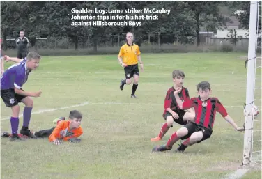  ??  ?? Goalden boy: Larne striker McCauley Johnston taps in for his hat-trick against Hillsborou­gh Boys