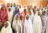  ?? — AFP ?? In this photo taken on Friday, released Nigerian school girls who were kidnapped from their school in Dapchi wait to meet the Nigerian president at the Presidenti­al Villa in Abuja.