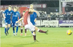  ?? ?? Nicky Low converts a penalty to make it 2-0 to Kelty. Right – It wasn’t a winning start for new Peterhead boss Davie Robertson