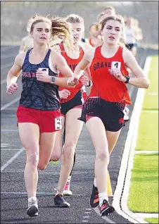  ?? Randy Moll/Westside Eagle Observer ?? Gravette junior Julia Whorton (right) leads the pack in the third lap of the 1600-meter run at the Gravette Running Festival on Friday. Whorton went on to win the event, as well as the 3200-meter run.