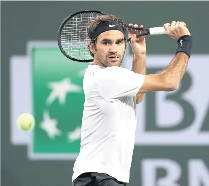 ??  ?? Roger Federer of Switzerlan­d returns a shot to Chung Hyeon of South Korea.