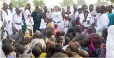  ??  ?? Mrs Margaret Elizabeth Binga and Chika Chukwumeri­j with the kids e during training exercise at Farm Center camp in Maiduguri