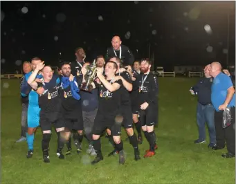  ??  ?? Carbury revel in the glory following their win over Athenry on Friday last. Photos: Noel Kennedy