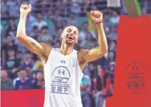  ?? Visual China Group ?? Golden State Warriors All-Star guard Stephen Curry soaks up the fan adulation on a visit to Chengdu, China, in July.