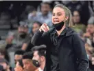  ?? ERIC GAY/AP ?? Spurs assistant coach Becky Hammon directs players during a game against the Dallas Mavericks on Nov. 12 in San Antonio.