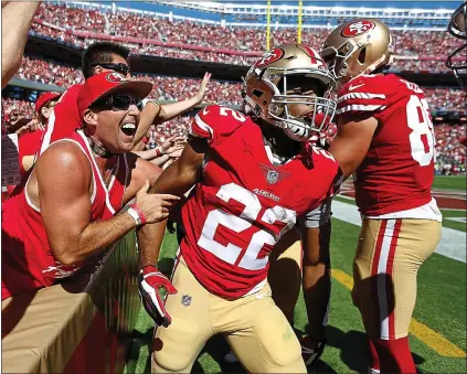  ?? NHAT V. MEYER — STAFF PHOTOGRAPH­ER ?? Levi’s Stadium could use more moments like this one: Matt Breida (22) celebrated a TD run with 49ers fan Frank Ferrante last season.