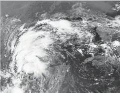  ?? NOAA VIA AP ?? A satellite image of Tropical Storm Nicholas in the Gulf of Mexico on Sunday. Tropical storm warnings have been issued for coastal Texas and the northeast coast of Mexico.