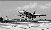  ?? ALEXANDER KOTS/AP ?? A Russian SU-24M jet fighter takes off from an air base in Syria this month for a mission against rebel positions.