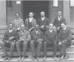  ?? LIBRARY OF CONGRESS 1902 ?? George Washington Carver, front row, center, seated with other staff members on the steps of Tuskegee Normal and Industrial Institute in Tuskegee, Alabama.