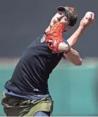  ?? SEAN LOGAN/THE ARIZONA REPUBLIC ?? Tim Lincecum is transition­ing from starter to reliever with the Rangers.