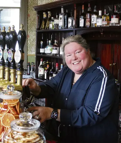  ?? PHOTO: ASHLEY SMYTH ?? Pumped . . . Katrina McLarin pours the first pint at her new establishm­ent, the Criterion Hotel, in Oamaru, yesterday.