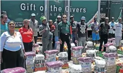  ?? Picture: Thapelo Morebudi ?? Imtiaz Sooliman with volunteers and NGO workers surrounded by emergency relief supplies.