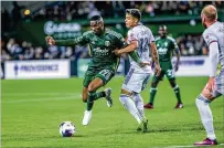  ?? SEAN MEAGHER/THE OREGONIAN VIA AP ?? Portland Timbers defender Juan David Mosquera (left), playing against St. Louis City last week, has one goal and one assist this season. The Timbers will be without several players today because of injuries.