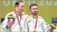  ?? PTI ?? Gold medallist Manish Narwal (R) and silver medallist Singhraj Adhana made it a one-two for India in P4-Mixed 50m Pistol.