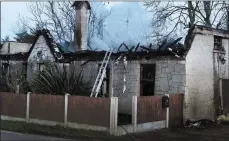  ??  ?? The cottage in Ballyedmon­d after the fire.