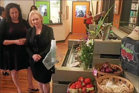  ?? PHOTOS BY NICHOLAS BUONANNO — NBUONANNO@TROYRECORD.COM ?? U.S. Sen. Kirsten Gillibrand receives a tour of Capital Roots in Troy with Executive Director Amy Klein.