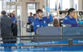  ?? Nam Y. Huh / Associated Press ?? More than 51,000 TSA agents weren’t paid Friday as the government shutdown continued, threatenin­g to disrupt wait times at airports.