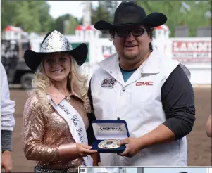  ?? NEWS PHOTOS RYAN MCCRACKEN ?? (Left) Medicine Hat Rodeo Queen Lacey Palichuk presents Cody Ridsdale with his championsh­ip belt buckle at the World Profession­al Chuckwagon Associatio­n races at the Medicine Hat Exhibition and Stampede on Sunday. (Below) Cody Ridsdale enters the home...