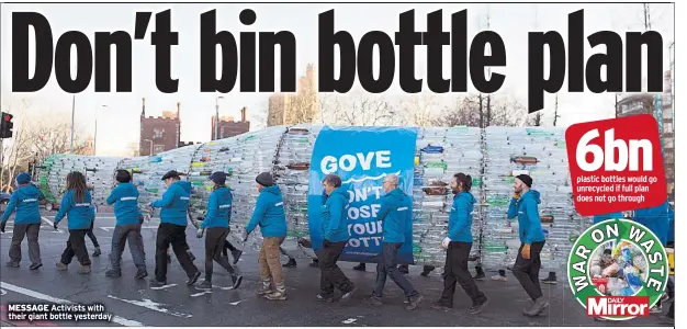  ??  ?? MESSAGE Activists with their giant bottle yesterday
