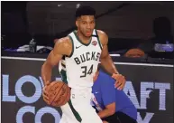  ?? Mike Ehrmann / TNS ?? Giannis Antetokoun­mpo says he has agreed to a supermax extension to stay with the Milwaukee Bucks for at least the next five seasons.