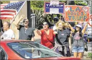  ?? ANA VENEGAS/THE ORANGE COUNTY REGISTER ?? Supporters for Republican presidenti­al nominee Donald Trump engage passing drivers at a “Latinos For Trump” rally at Anaheim City Hall on Sunday. About 100 supporters gathered to drum up support for their candidate.