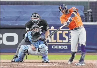  ?? Jae C. Hong The Associated Press ?? Houston’s Carlos Correa doubles for one of his three hits Friday against the Tampa Bay Rays. The Astros had 11 hits as a team as they won 7-4 to tied the series 3-3.