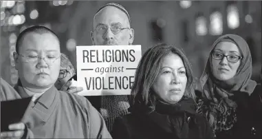  ?? AFP ?? People take part in a vigil for those killed on Wednesday in New York City. The Council on American-Islamic Relations organized the event a day after the attack in lower Manhattan that killed eight people.