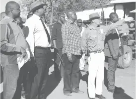  ??  ?? The manager of Mary Ellen farm Mr Peter Evans (right) shows Vice-President Phelekezel­a Mphoko (second left) around during the VP’s visit to the farm in Bubi district yesterday. Looking on is the Member of Parliament for Bubi who is also the Minister of...