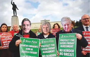  ?? Reuters ?? Sinn Fein members hold a protest against Brexit outside Stormont, in Belfast, Northern Ireland, yesterday.