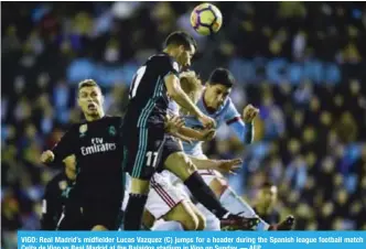  ??  ?? VIGO: Real Madrid’s midfielder Lucas Vazquez (C) jumps for a header during the Spanish league football match Celta de Vigo vs Real Madrid at the Balaidos stadium in Vigo on Sunday. — AFP