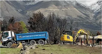  ?? BEJON HASWELL/STUFF ?? Only two Lake O¯ hau Village properties remain to be cleared and rebuild applicatio­ns are coming in.