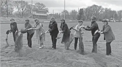  ?? CAROLINE BECK/INDYSTAR ?? Indianapol­is Public Schools officials break ground on Tuesday at the former Broad Ripple High School campus, which will now open as a middle school for the 2024-25 school year. IPS will be investing $410 million into school renovation­s in the coming years.