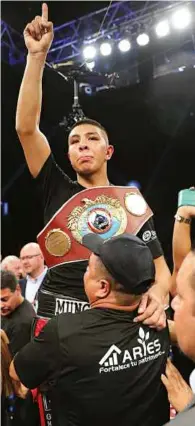  ??  ?? RETAINER: Munguia is declared a unanimous winner