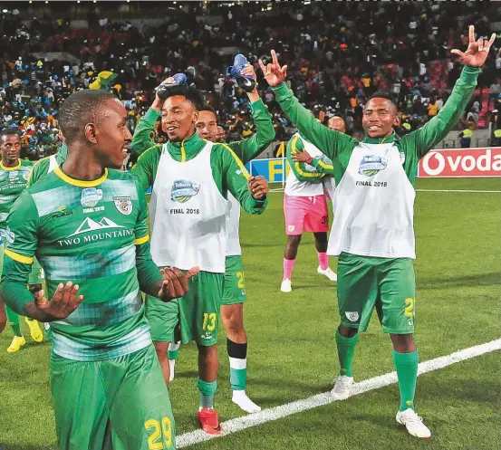  ??  ?? The Baroka FC players celebrate after the Limpopo club secured the first top-flight trophy in their history, beating Orlando Pirates on penalties in the 2018 Telkom Knockout final.